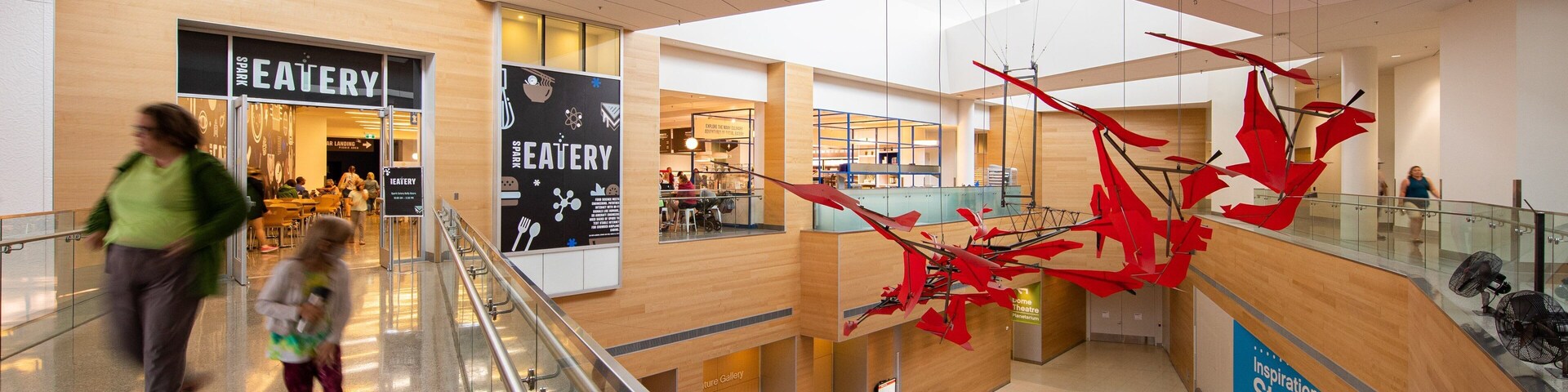 TELUS Spark featuring interior views as well as a family