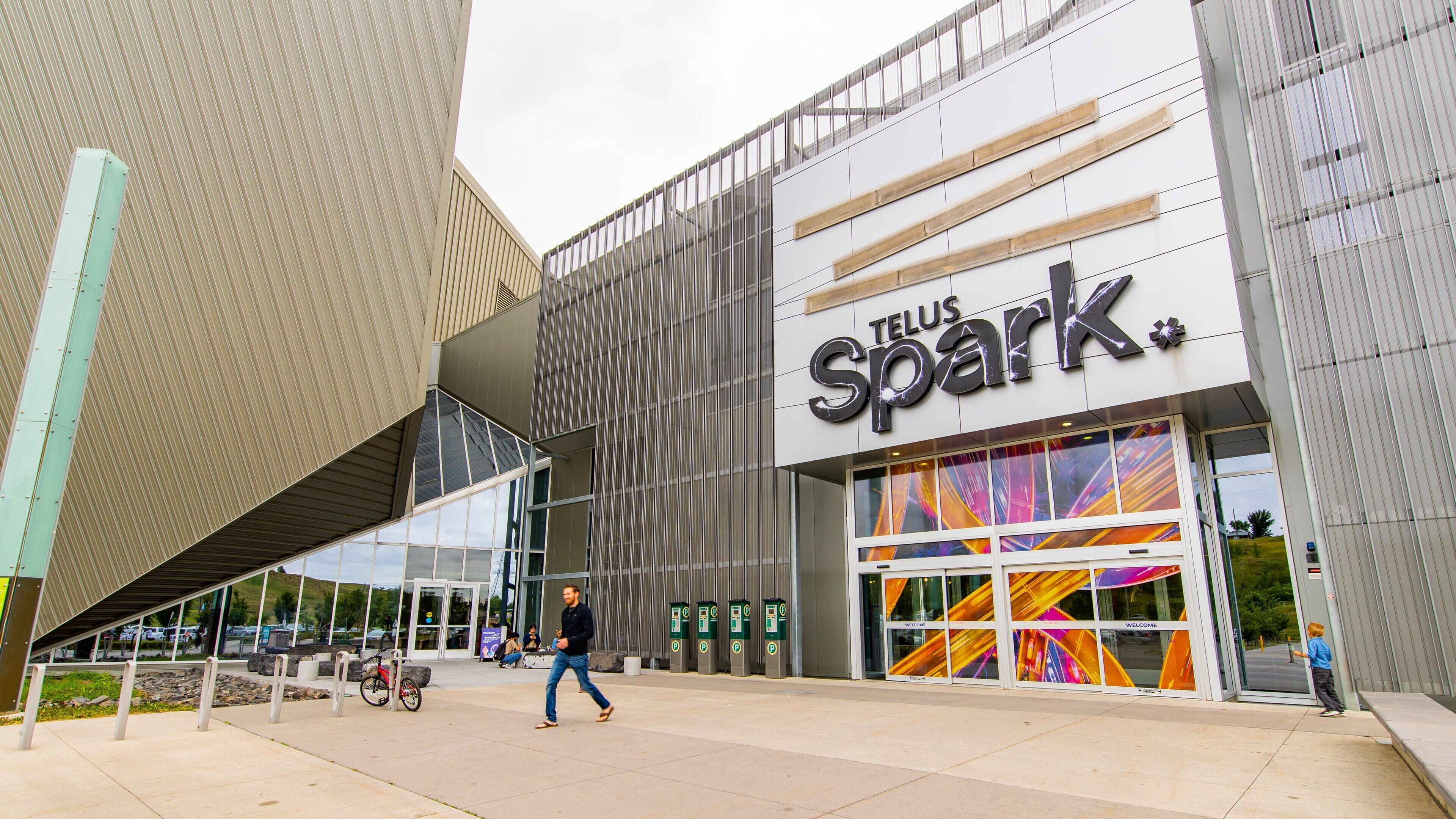 A modern building with a large sign reading "TELUS Spark."