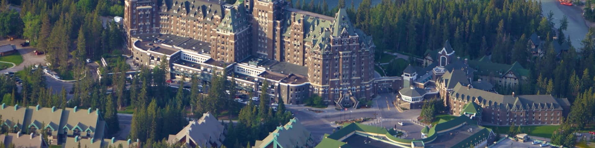 Banff Gondola which includes a small town or village, a river or creek and heritage architecture