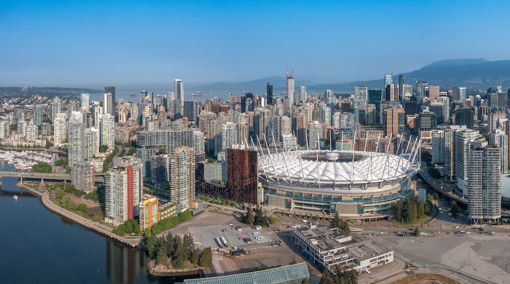 Vancouver, BC, Canada, aerial panoramic city view of famous False Creek in Vancouver downtown with Cambie Bridge and BC Place Stadium in front and Vancouver Skyline in the background