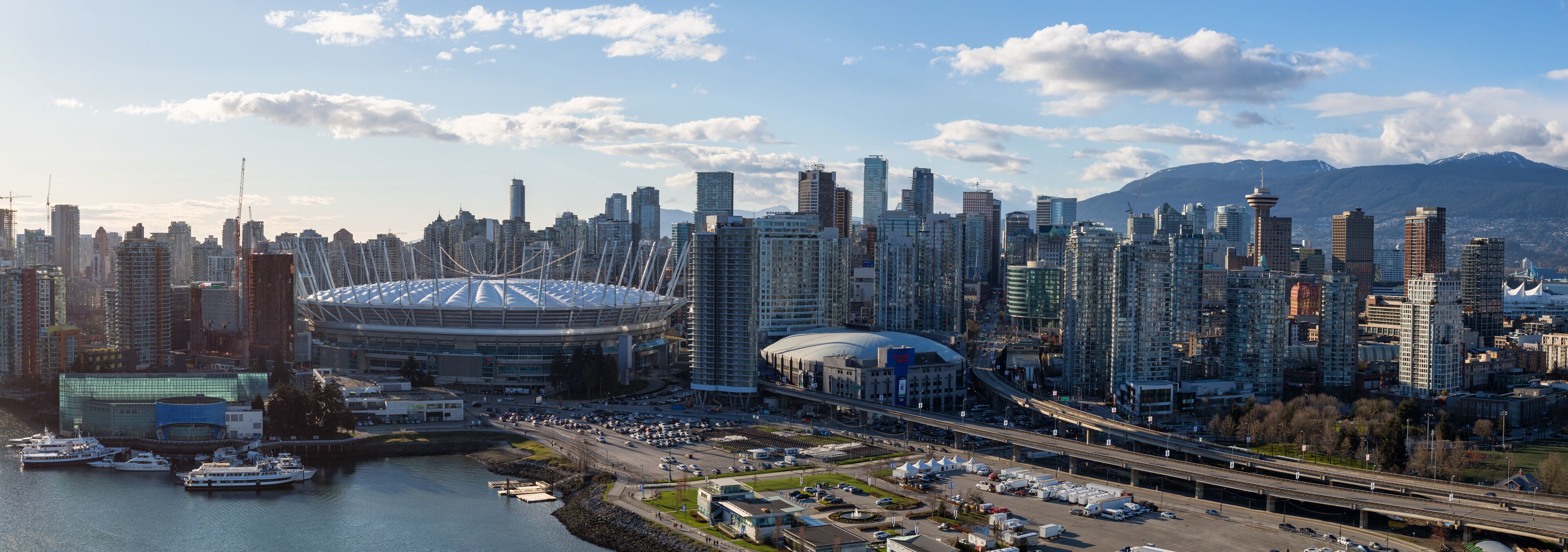 Downtown Vancouver, BC, Canada - Apr 02, 2017 - Aerial Panoramic View of the City Skyline, BC Place Stadium, Rogers Arena, around False Creek.