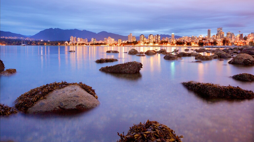 Kitsilano Beach which includes night scenes, a bay or harbor and general coastal views