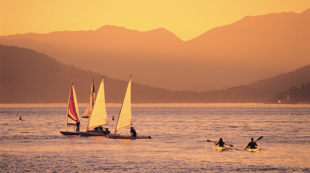 Jericho Beach which includes a sunset, mountains and sailing