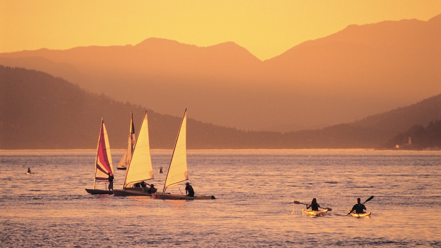 Jericho Beach which includes a sunset, mountains and sailing