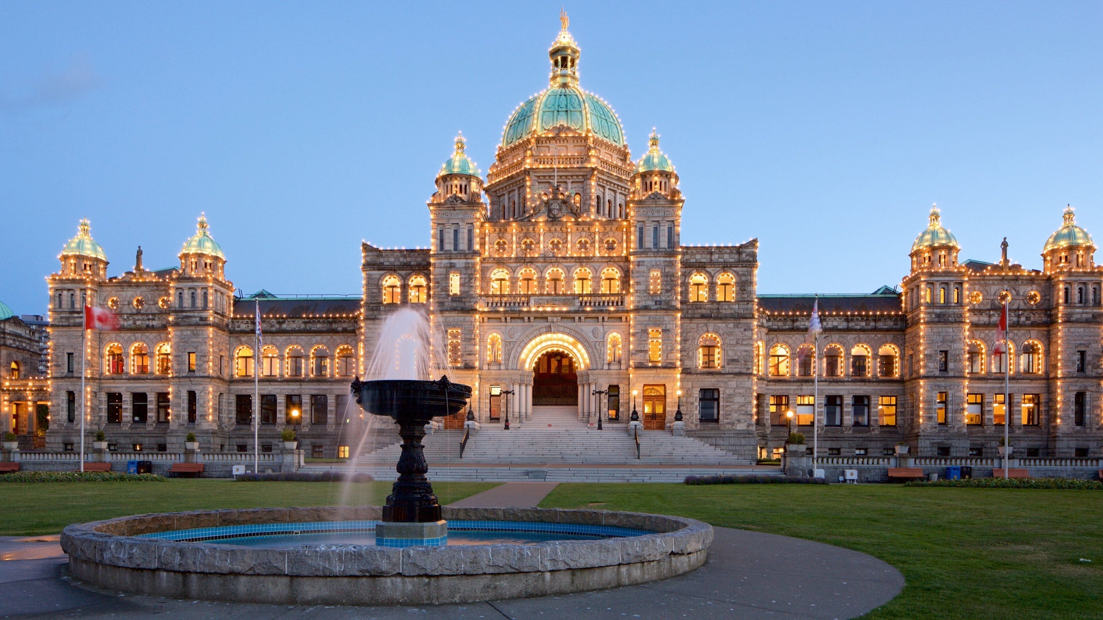 British Columbia Parliament Building showing a garden, night scenes and heritage architecture