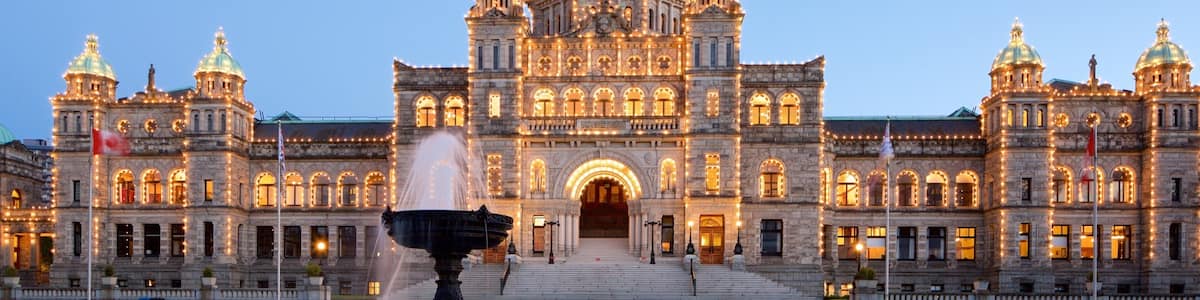 British Columbia Parliament Building showing a garden, night scenes and heritage architecture