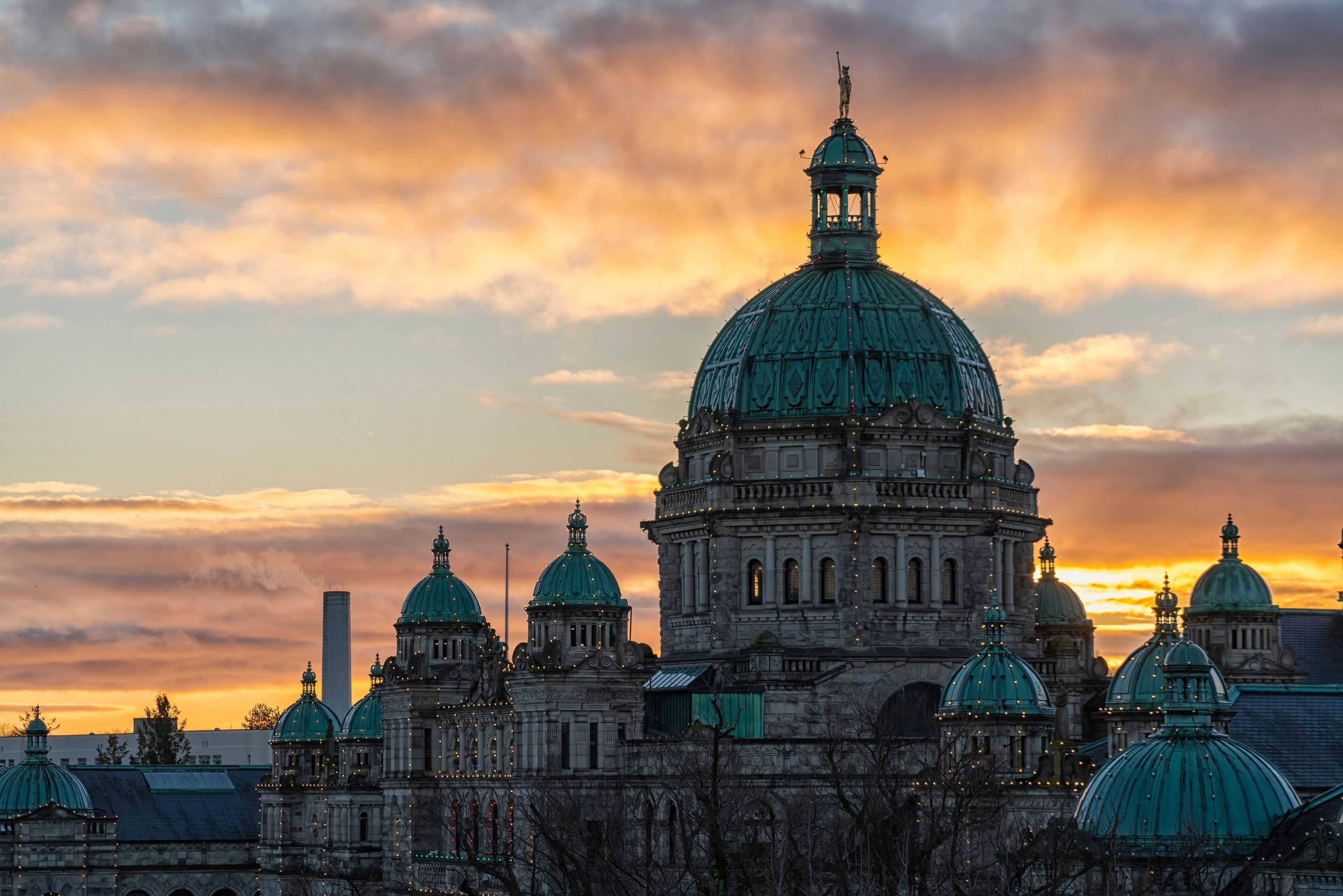Sunrise over the British Columbia Parliament Buildings in Victoria; Victoria, Vancouver Island, British Columbia, Canada
