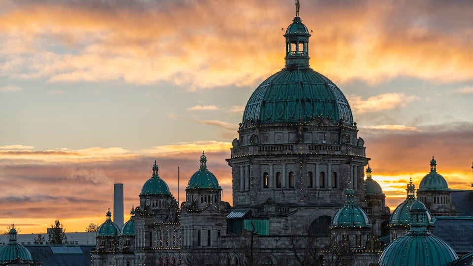 Sunrise over the British Columbia Parliament Buildings in Victoria; Victoria, Vancouver Island, British Columbia, Canada