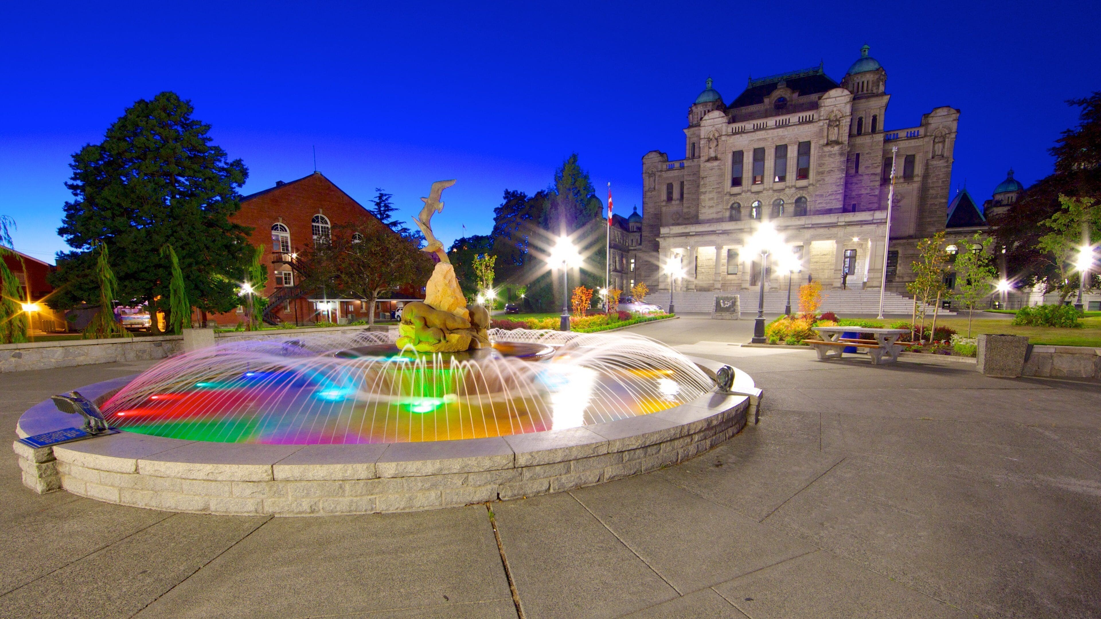 British Columbia Parliament Building which includes night scenes, a square or plaza and a fountain