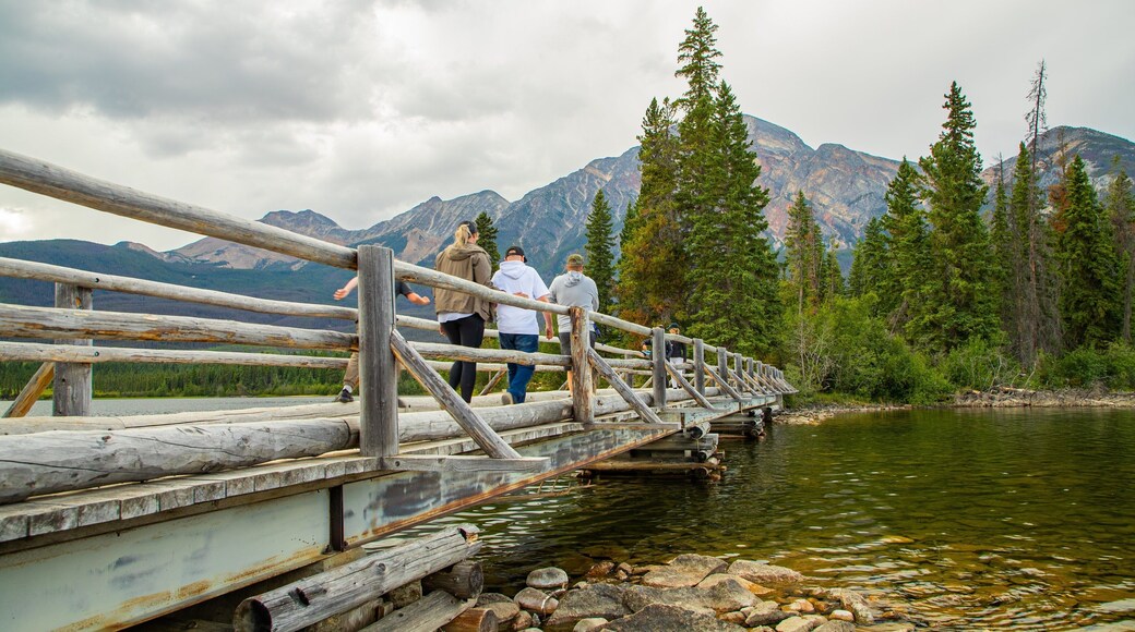 Pyramid Lake which includes a bridge and a river or creek as well as a small group of people