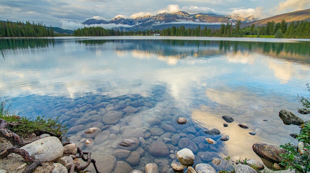 Lac Beauvert featuring a sunset and a lake or waterhole