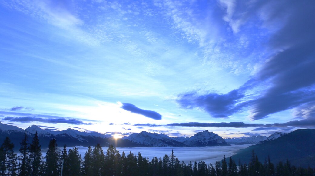 Marmot Basin featuring mountains, landscape views and a sunset