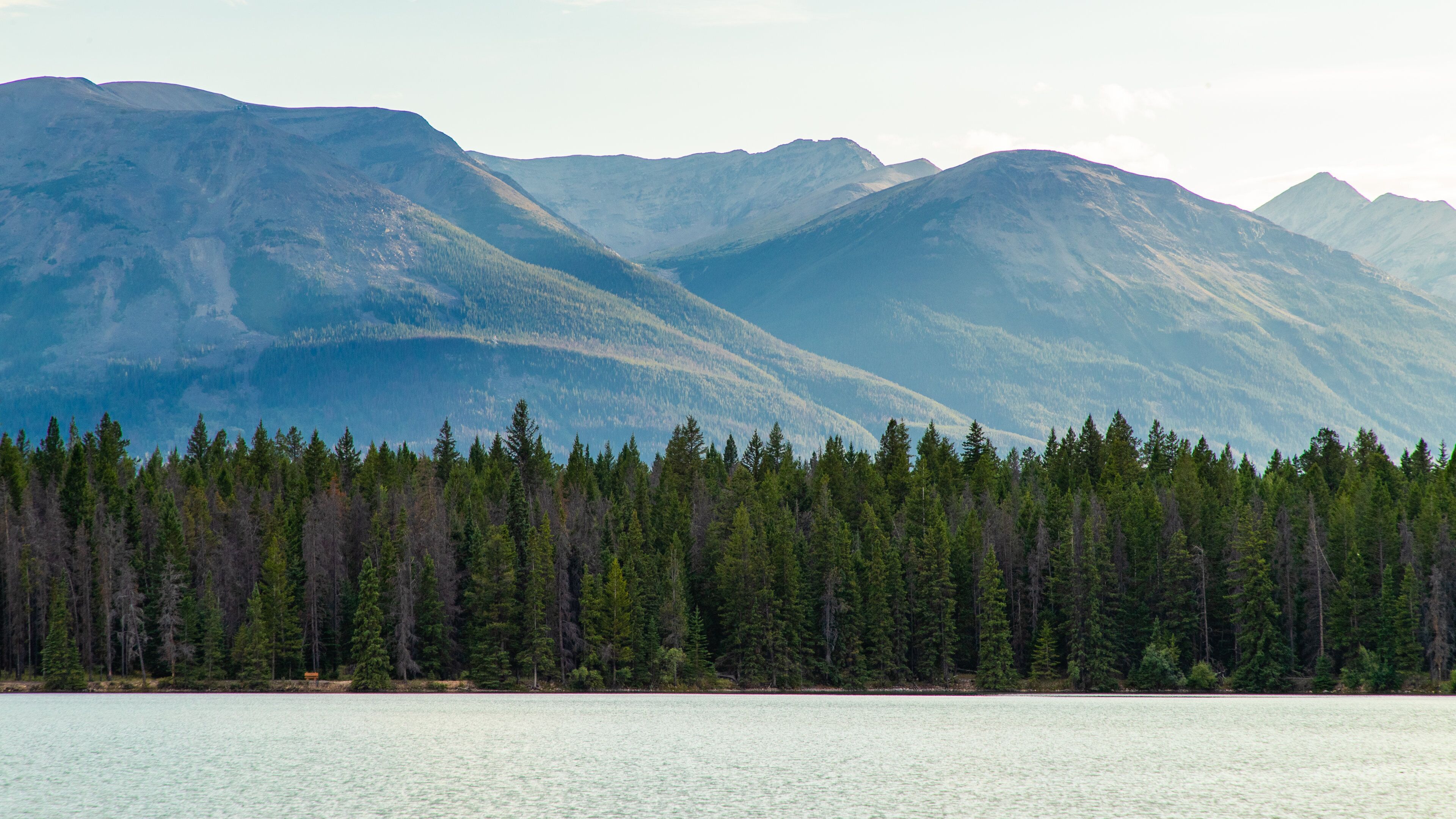 Lake Annette showing mountains, a sunset and a lake or waterhole