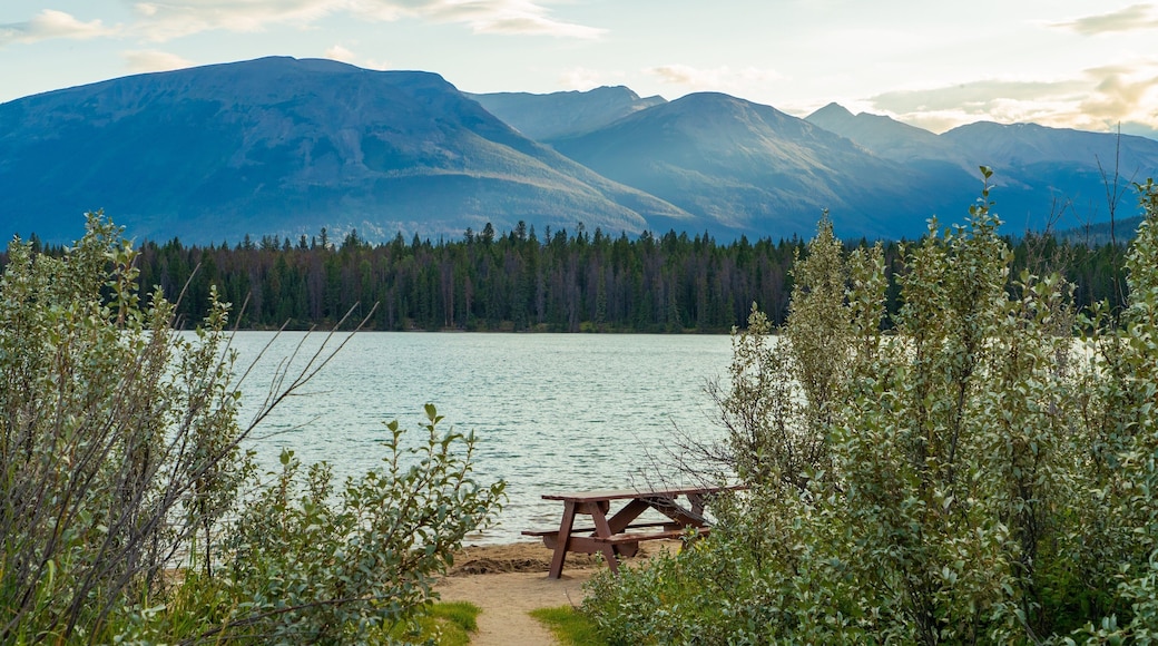 Lake Annette showing a sunset, a lake or waterhole and mountains