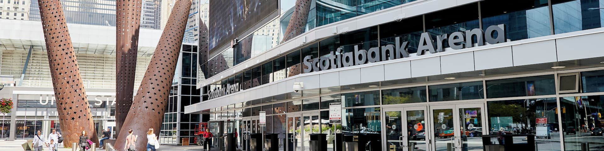 The Scotiabank Arena with modern architecture and a large digital sign.