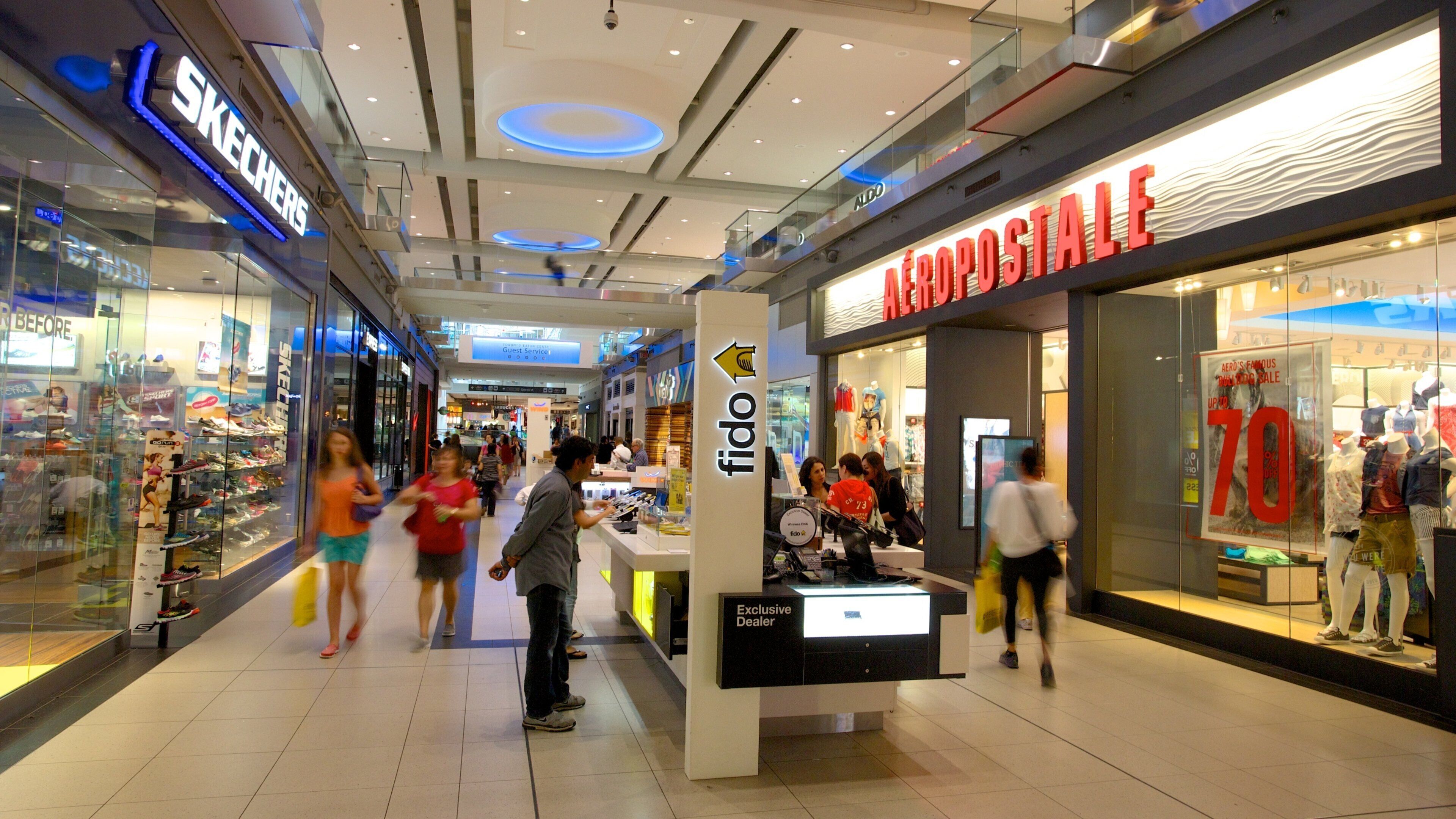 Toronto Eaton Centre which includes interior views, shopping and signage
