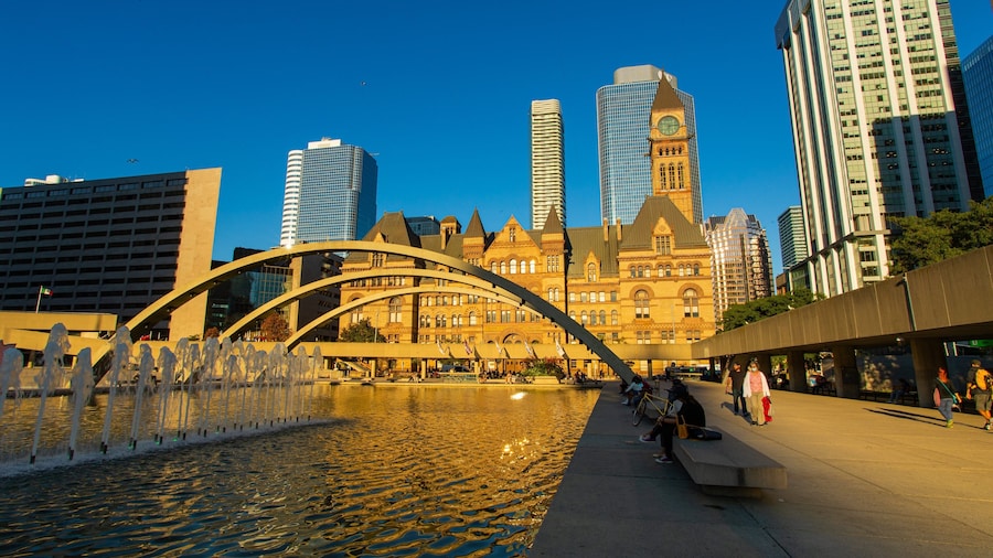 Nathan Phillips Square showing a pond, a city and a fountain