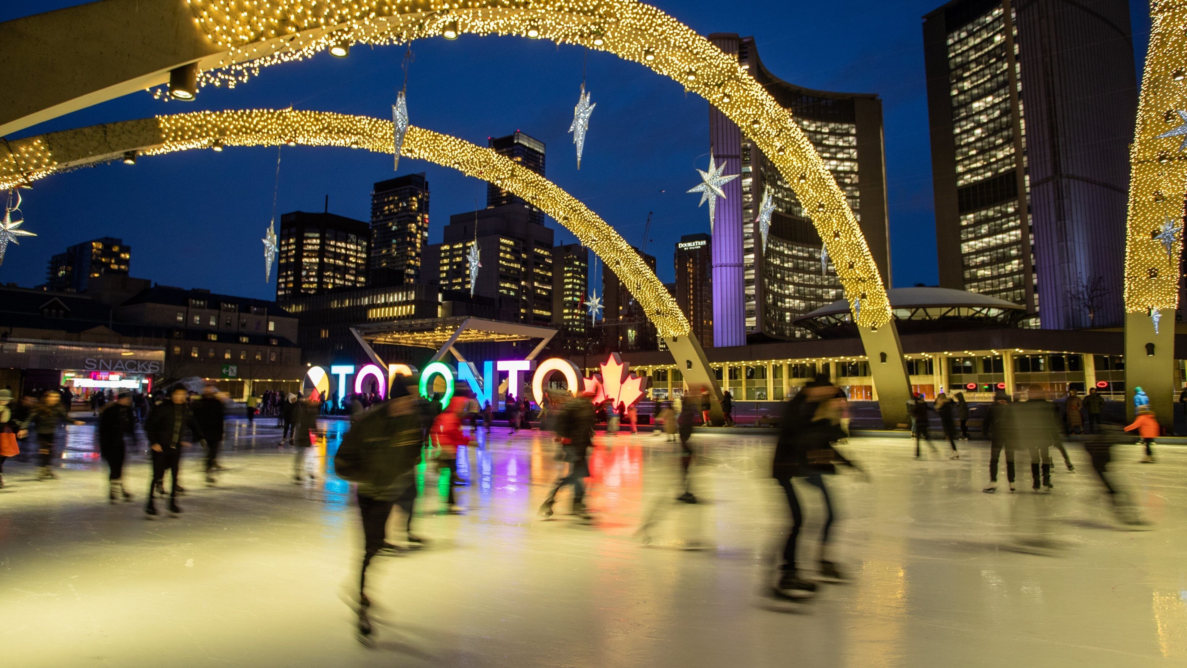 Nathan Phillips Square which includes a city, signage and snow skiing