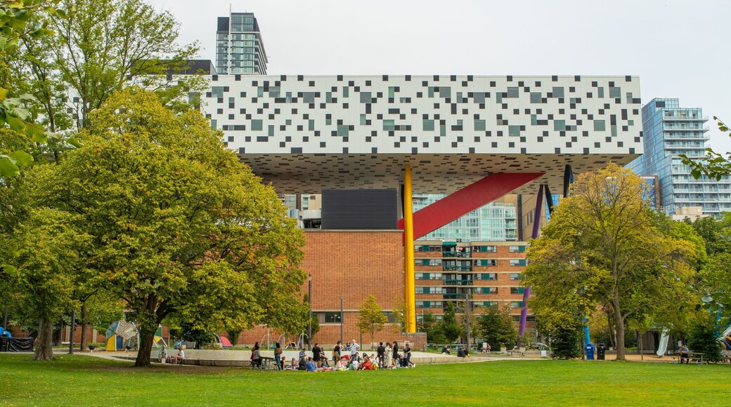 Ontario College of Art & Design University showing picnicing and a park as well as a small group of people