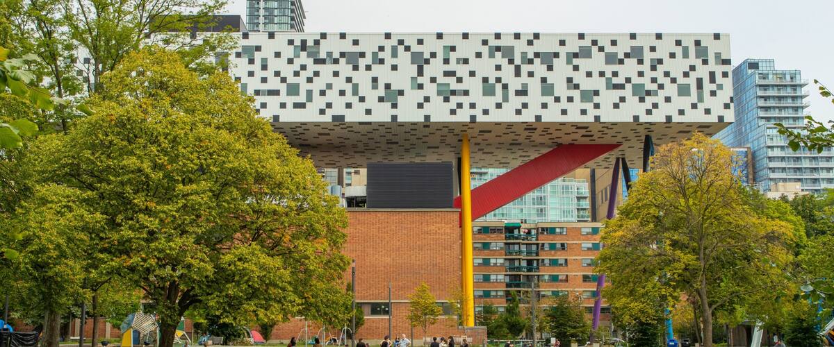 Ontario College of Art & Design University showing picnicing and a park as well as a small group of people