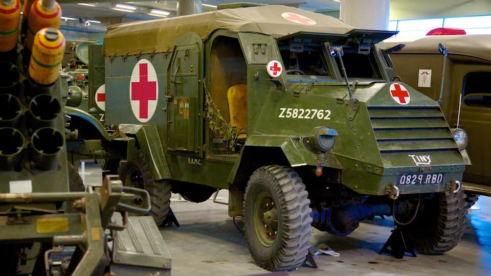A military vehicle with a red cross emblem, large tires, and the number Z5822762.