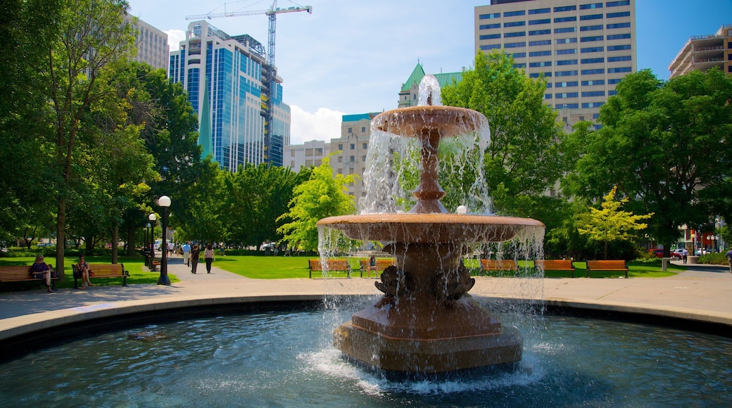 Rideau Canal featuring a garden, a city and a pond