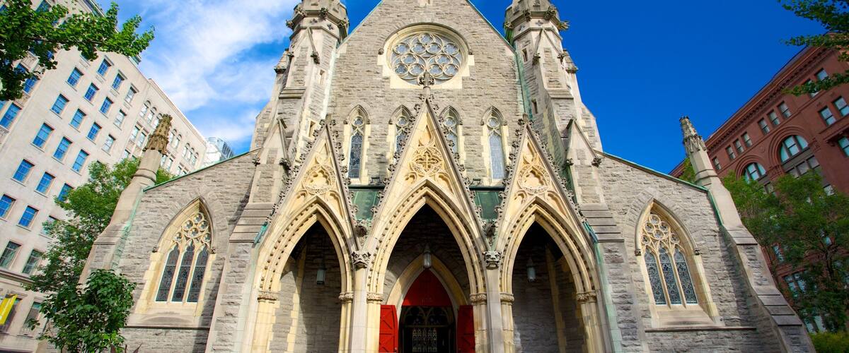 A historic church with Gothic architecture, featuring pointed arches, a large rose window, and a spire.