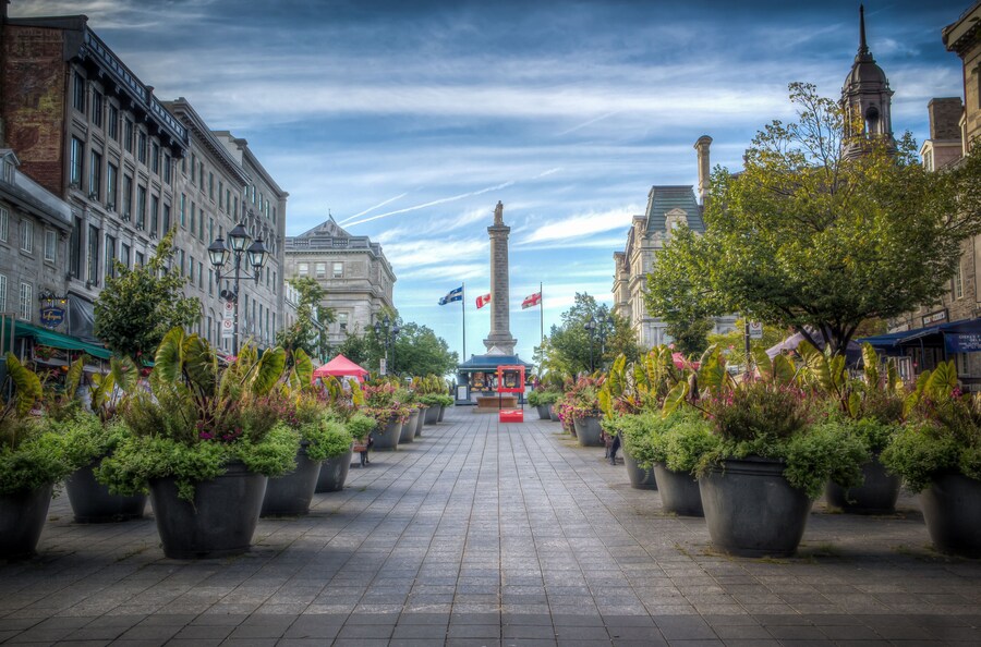 Vibrant view of Place Jacques-Cartier in Old Montreal with historic buildings and outdoor cafes.