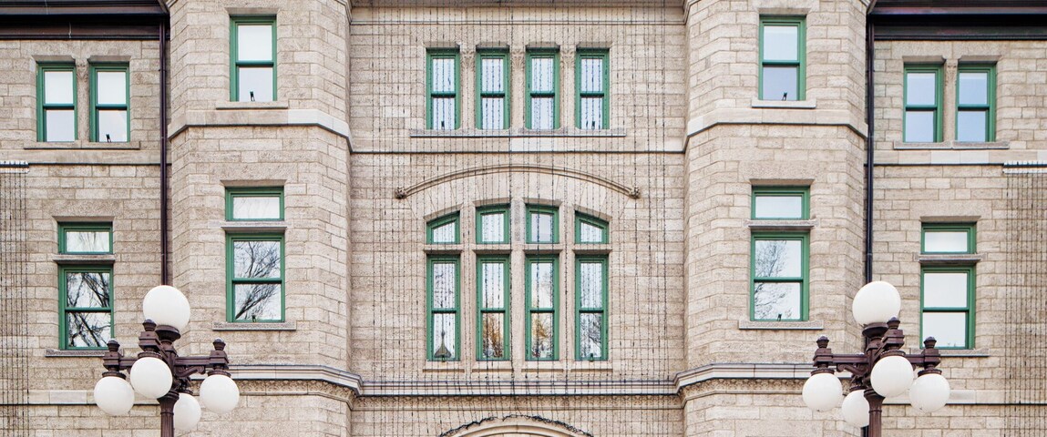 Quebec City's City Hall entrance with central tower and stairway leading to the building