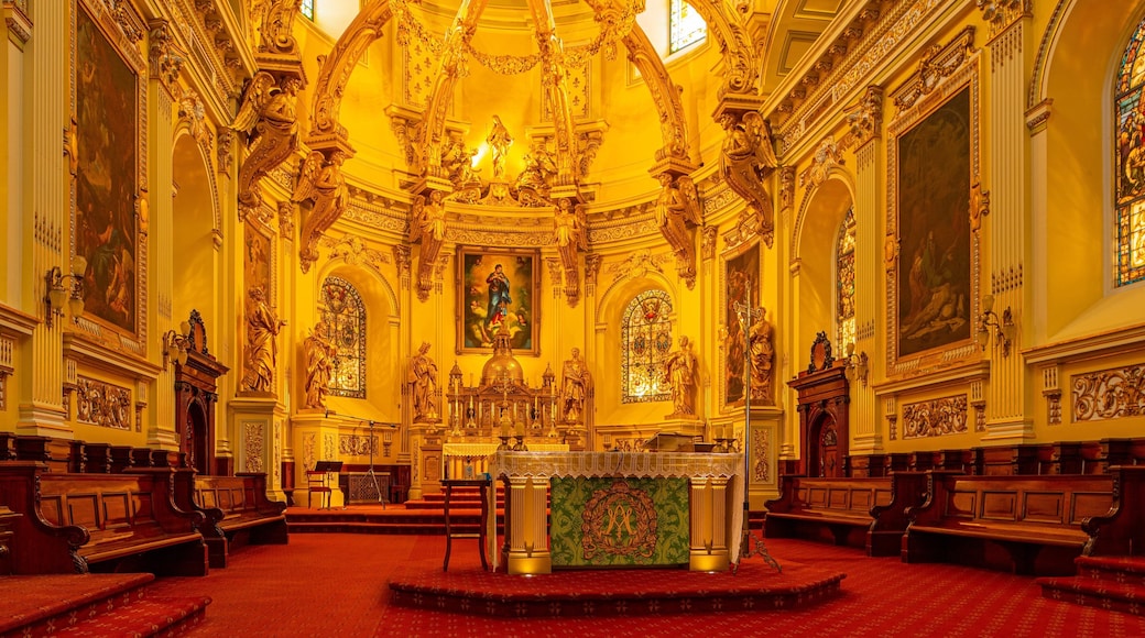 Basilique Cathedrale Notre-Dame of Quebec featuring a church or cathedral, heritage elements and interior views