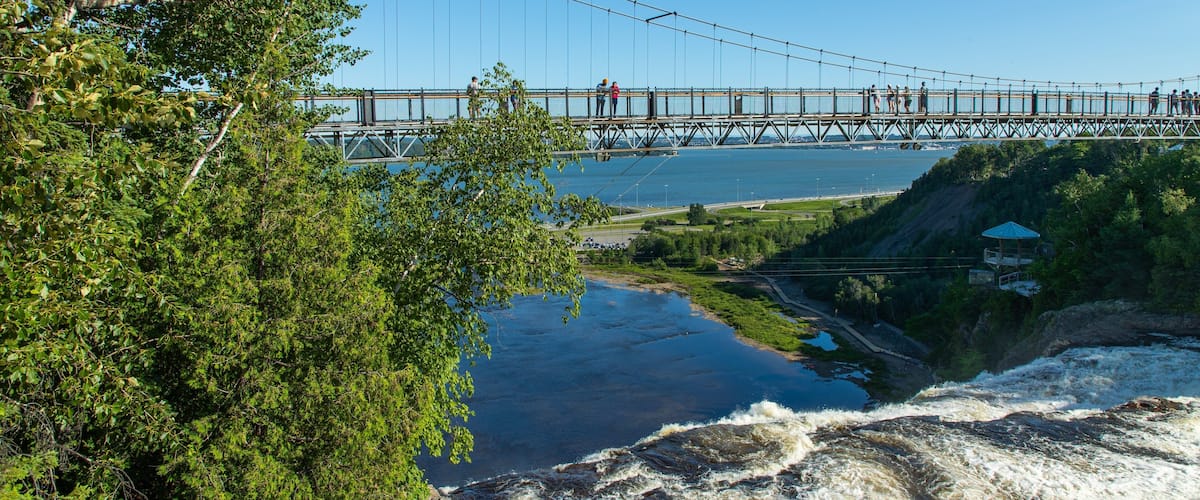 Montmorency Falls featuring a bridge and general coastal views