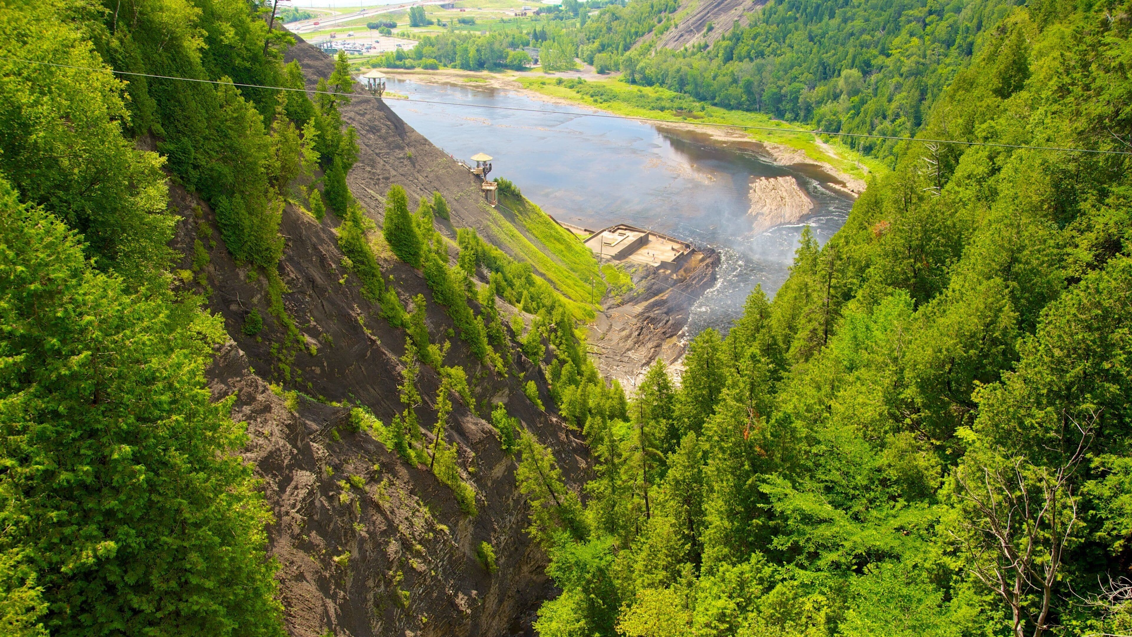Montmorency Falls featuring a river or creek and forests