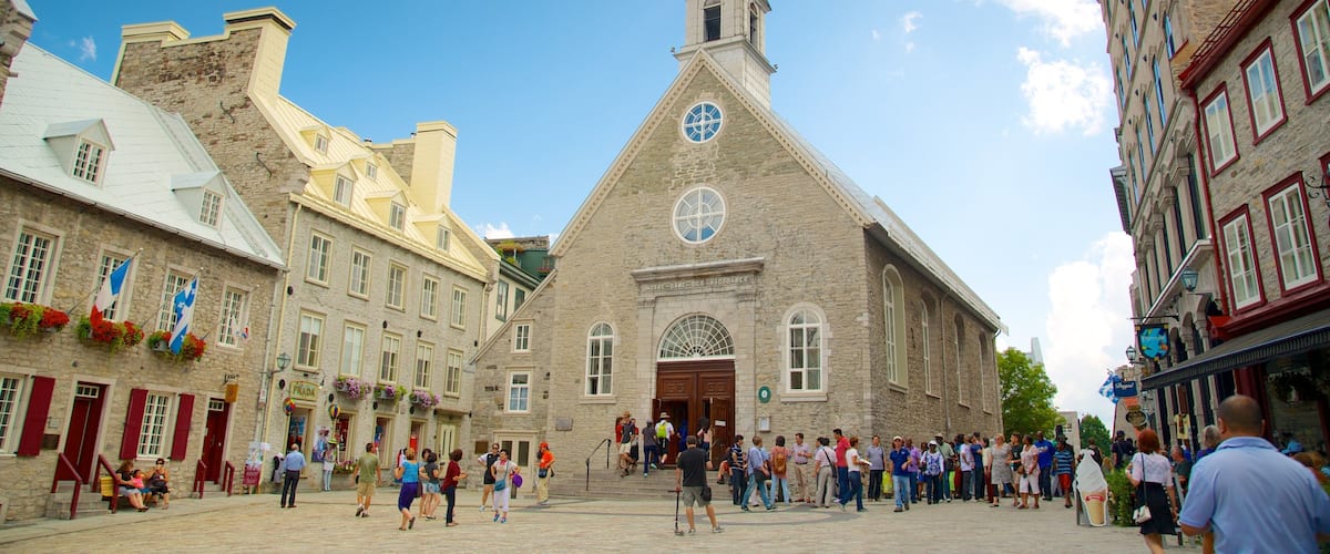 Church Notre-Dame-des-Victoires which includes heritage architecture, a city and a square or plaza