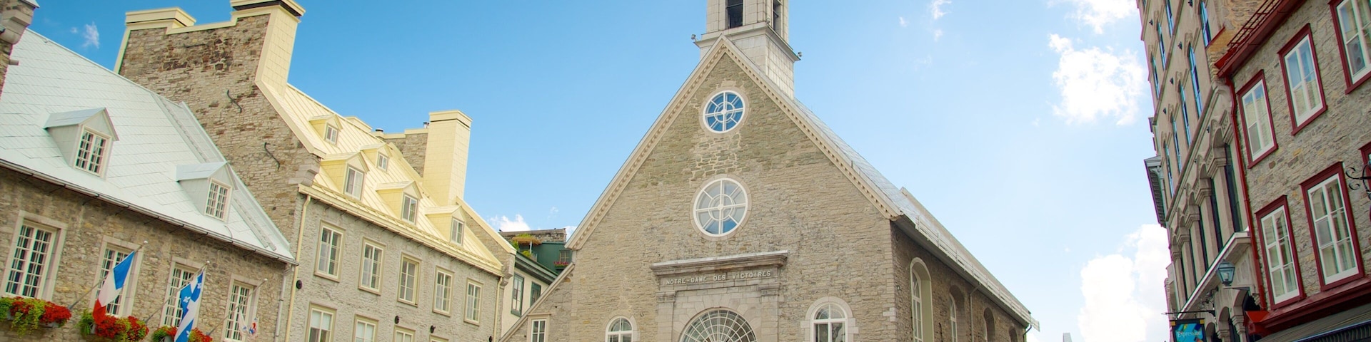 Church Notre-Dame-des-Victoires which includes religious elements, a square or plaza and a church or cathedral