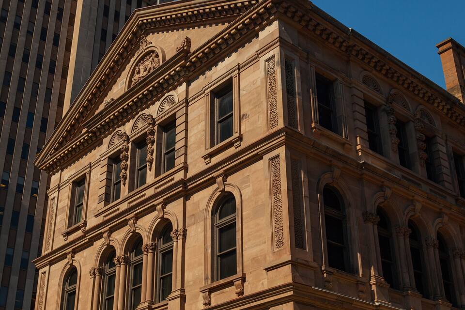 A historic building with ornate architectural details, including columns and decorative moldings.