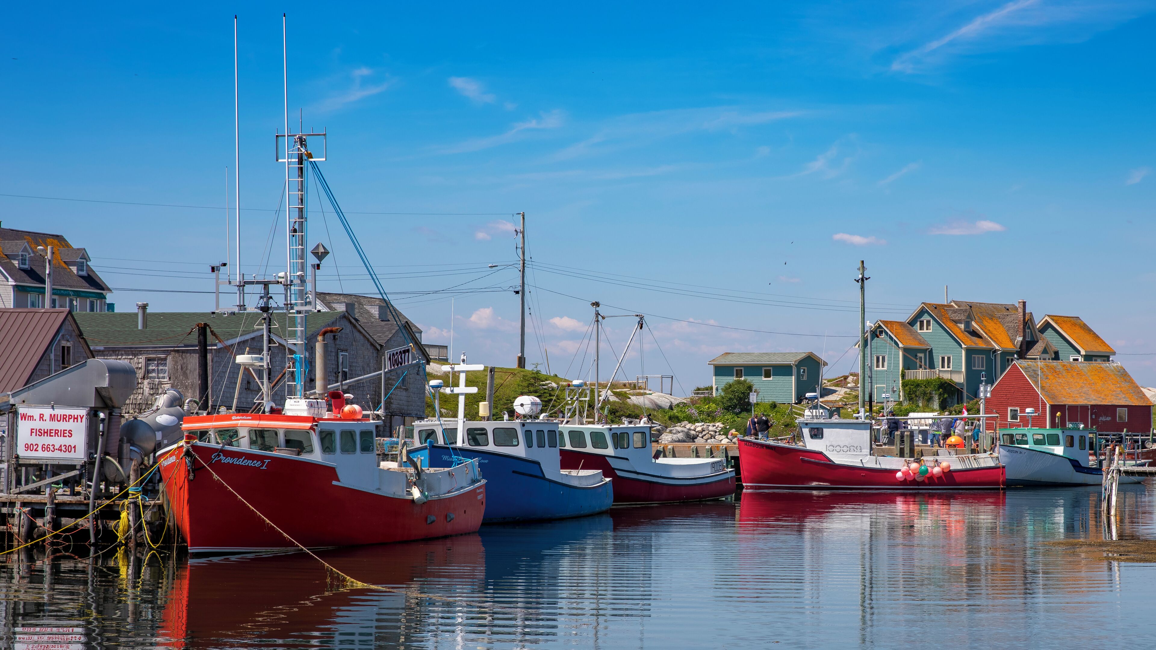 A perfect July day in Peggy's Cove. One can spend all day here exploring the rocks, sea, and docks.  Canon 5dMkIV