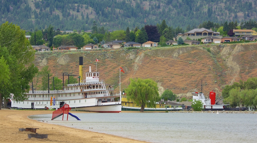 Okanagan Beach mostrando uma praia, uma baía ou porto e uma cidade pequena ou vila