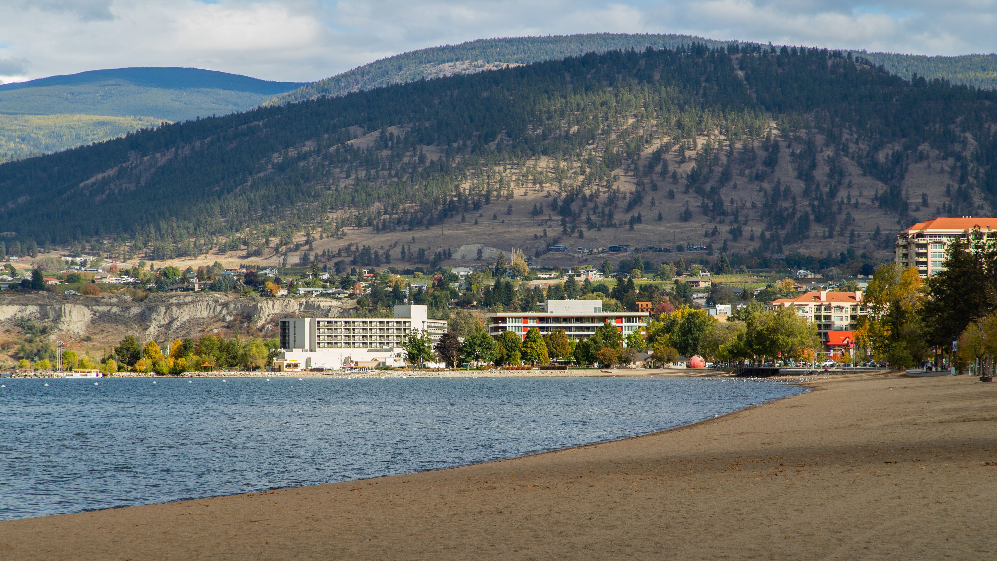Okanagan Beach showing a coastal town, general coastal views and a sandy beach