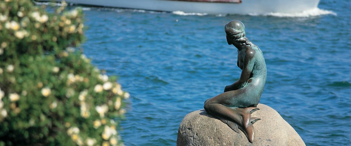 Little Mermaid which includes boating, a statue or sculpture and a river or creek