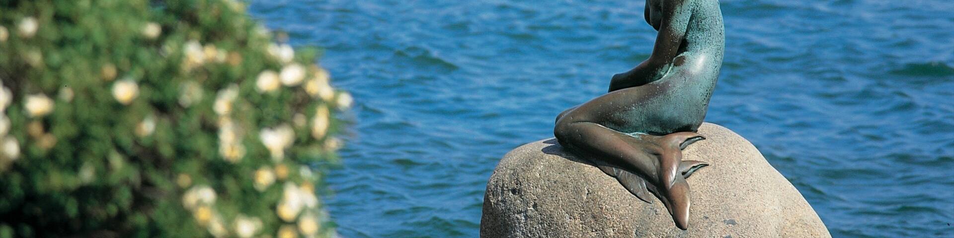 Little Mermaid featuring outdoor art, a river or creek and boating