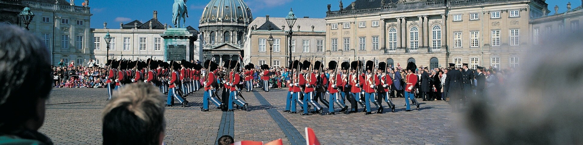 Amalienborg Palace featuring a castle, heritage architecture and a square or plaza