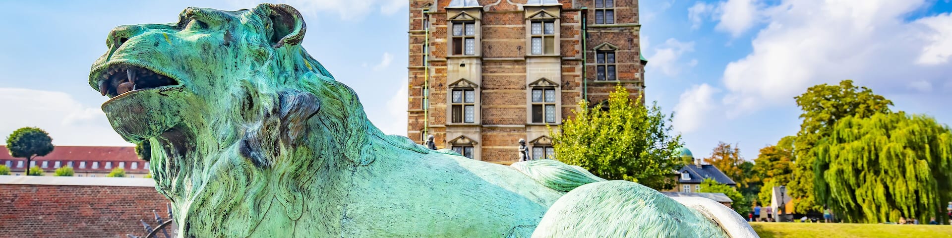 Rosenborg Castle in Copenhagen, Denmark. Selective focus on a lion on foreground.