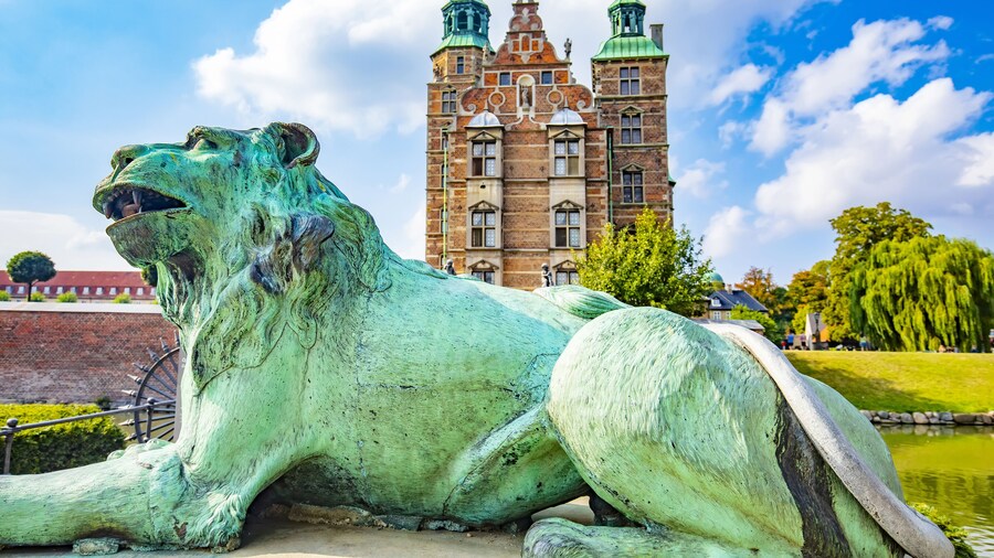 Rosenborg Castle in Copenhagen, Denmark. Selective focus on a lion on foreground.