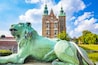 Rosenborg Castle in Copenhagen, Denmark. Selective focus on a lion on foreground.
