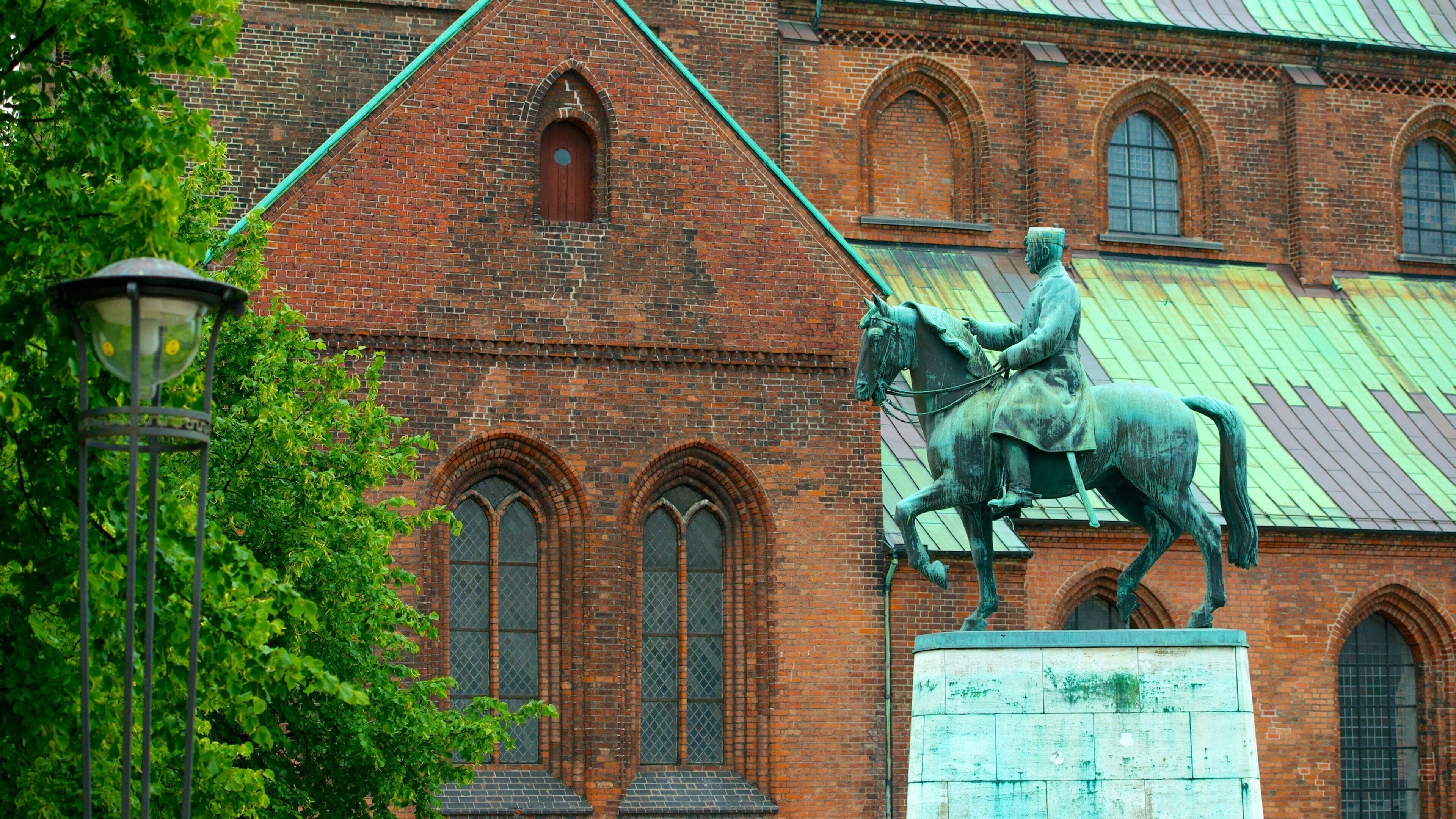Church of Our Lady featuring a statue or sculpture, heritage elements and a church or cathedral