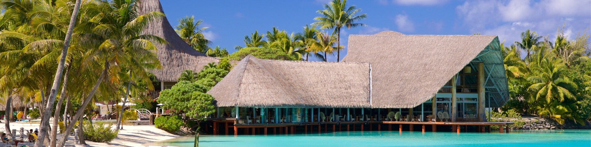 Le Meridien Beach which includes general coastal views, a sandy beach and swimming