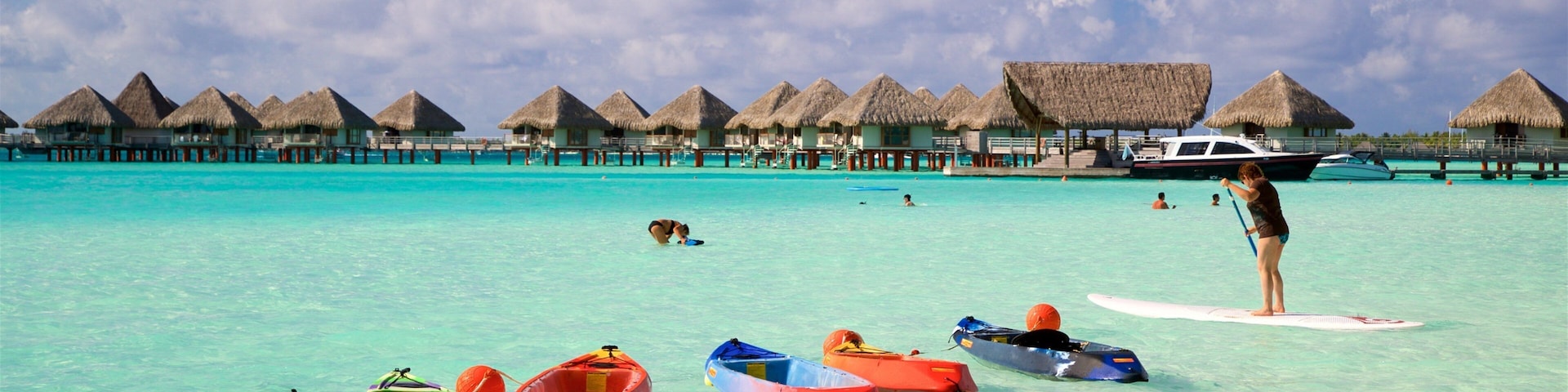 Le Meridien Beach which includes general coastal views, tropical scenes and kayaking or canoeing