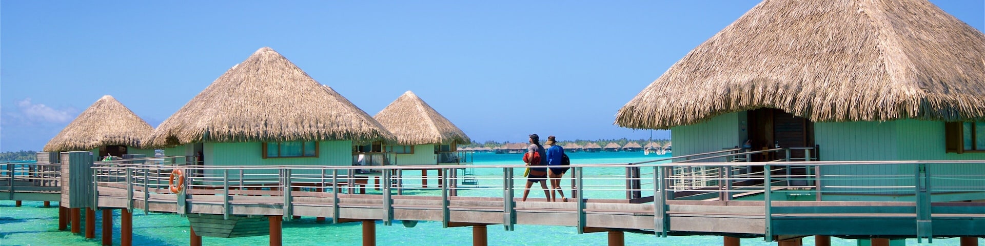 Le Meridien Beach which includes tropical scenes and general coastal views as well as a couple