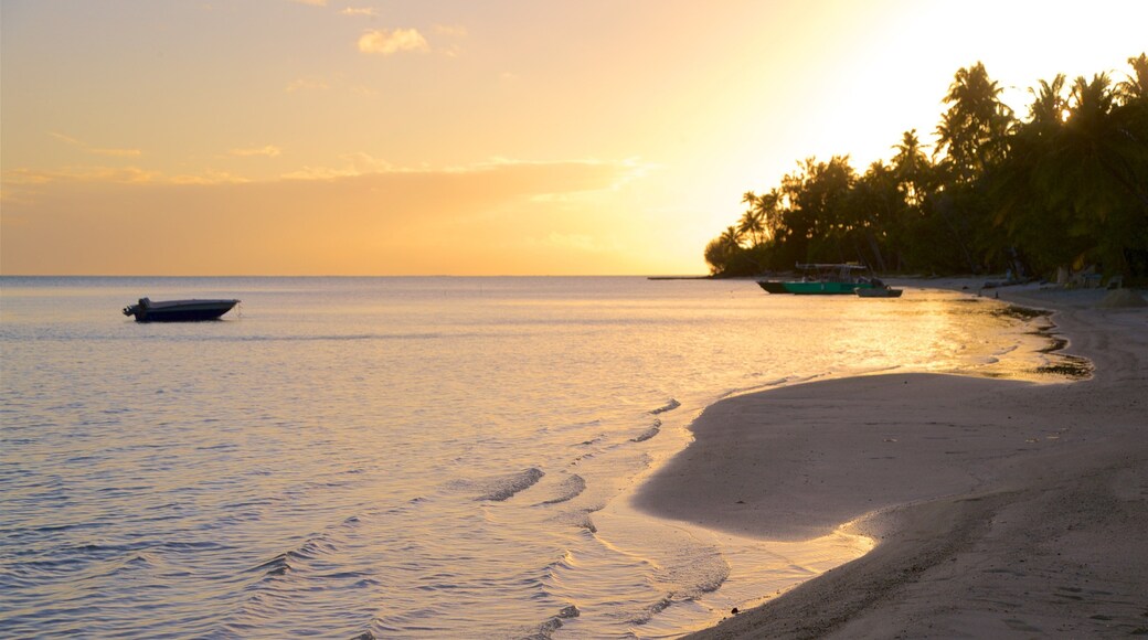 Matira Beach which includes a sandy beach, a sunset and general coastal views