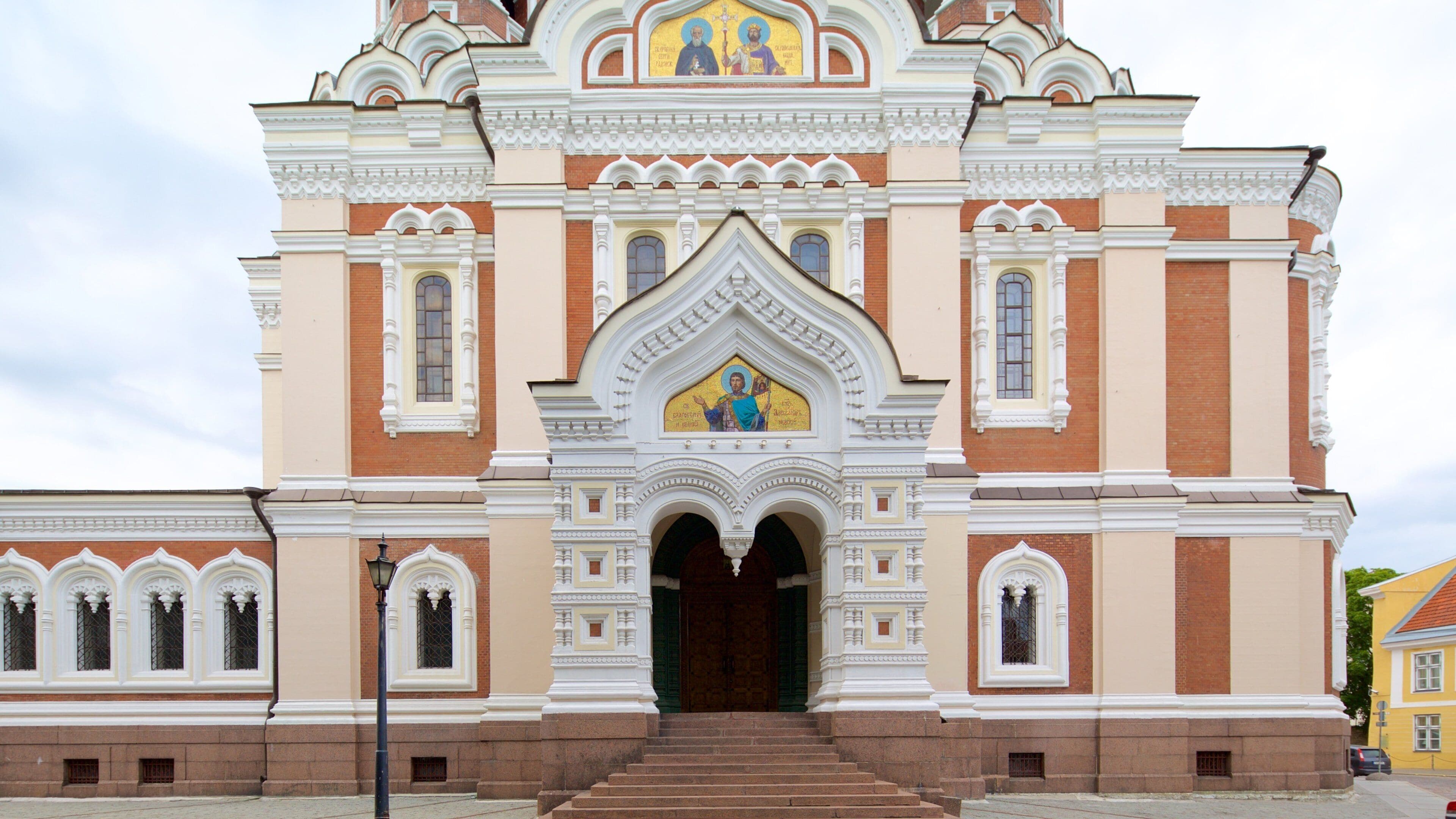 A church with a central entrance, arched windows, and a detailed facade.